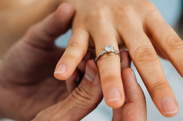 Just Gold Jewellery - romantic couple with engagment ring