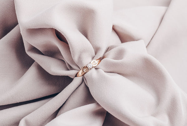 Just Gold Jewewllery - engagement gold ring with diamond on beige background
