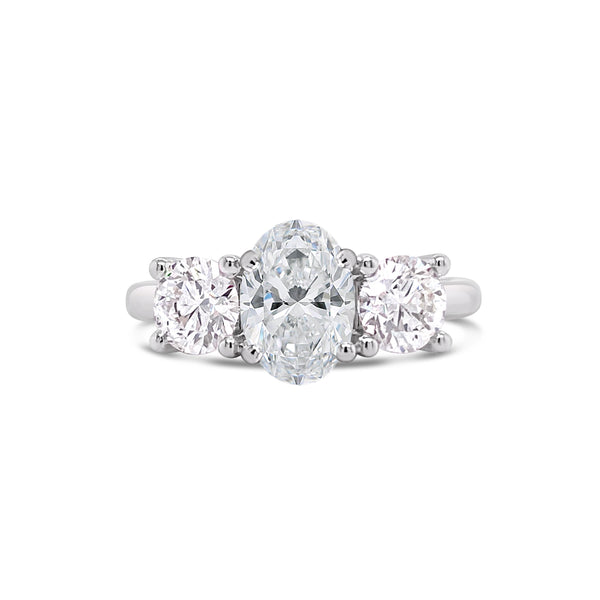Oval cut three stone engagement ring