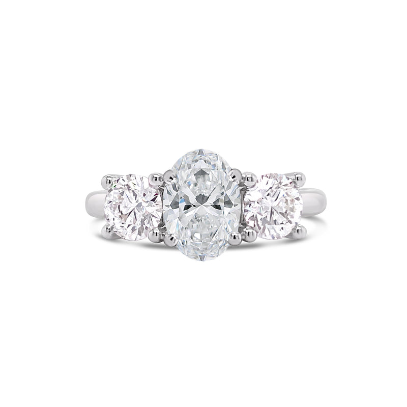 Oval cut three stone engagement ring