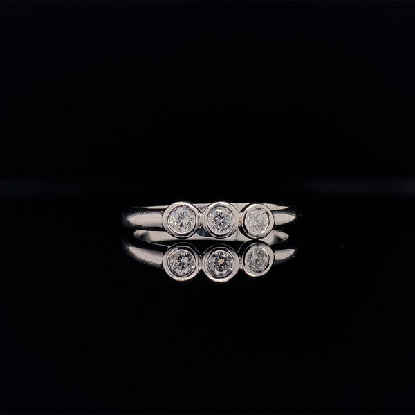 three diamond bezel ring