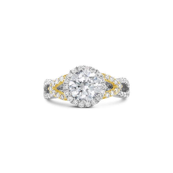 Round cut diamond halo ring with twisted shank