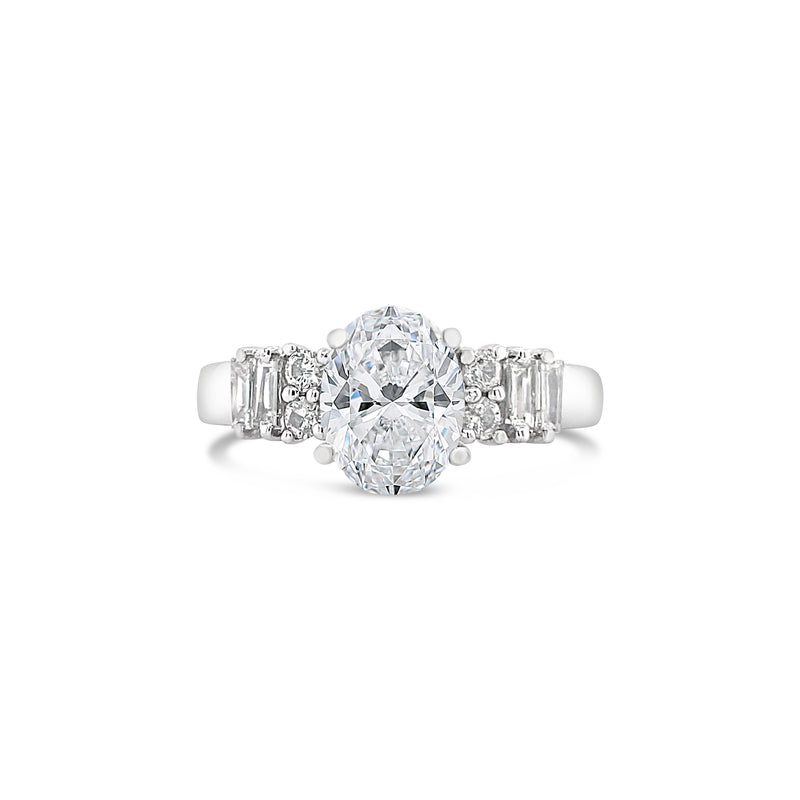 OVAL CUT DIAMOND RING WITH BAGUETTE AND ROUND BRILLIANT SIDE DIAMONDS