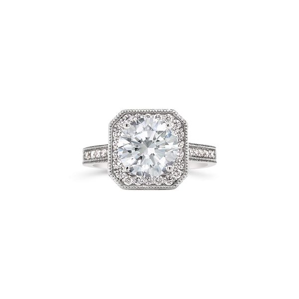 Edged halo round cut diamond ring